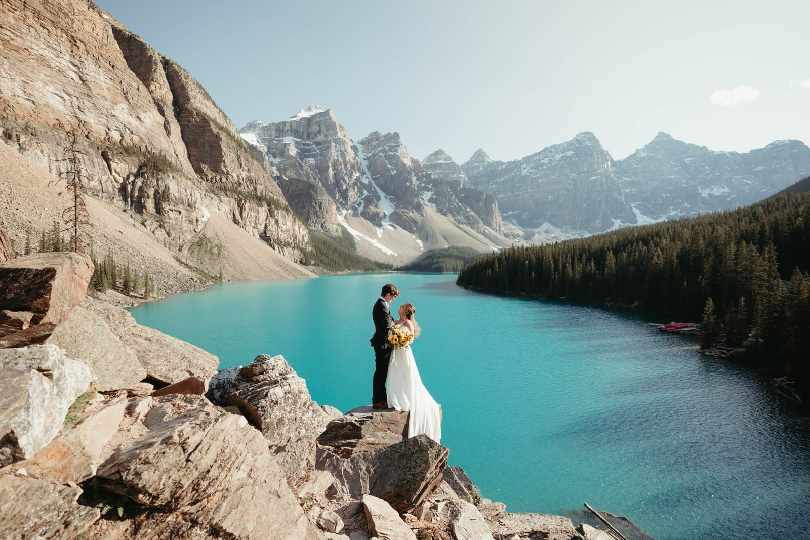 A photo shoot at Moraine Lake. We are kissing with the lake and mountains in the background